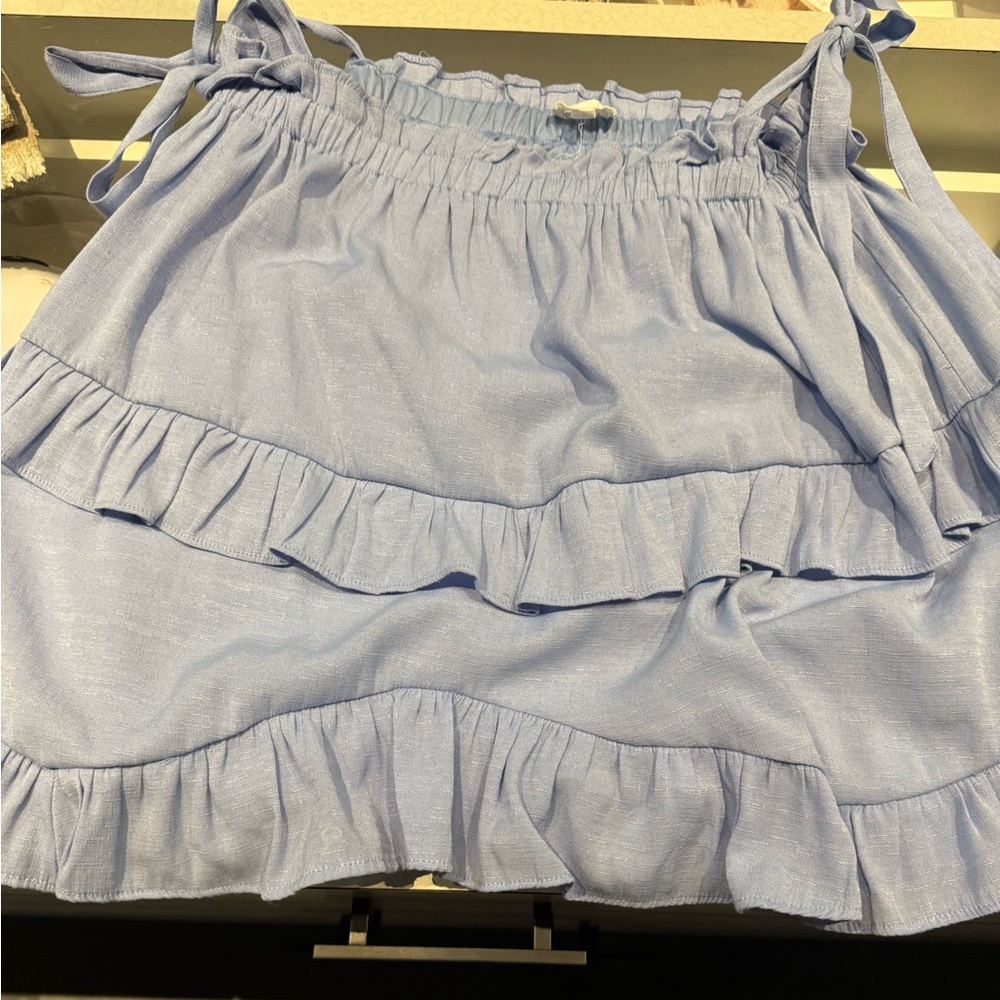 &merci blue top with feminine straps